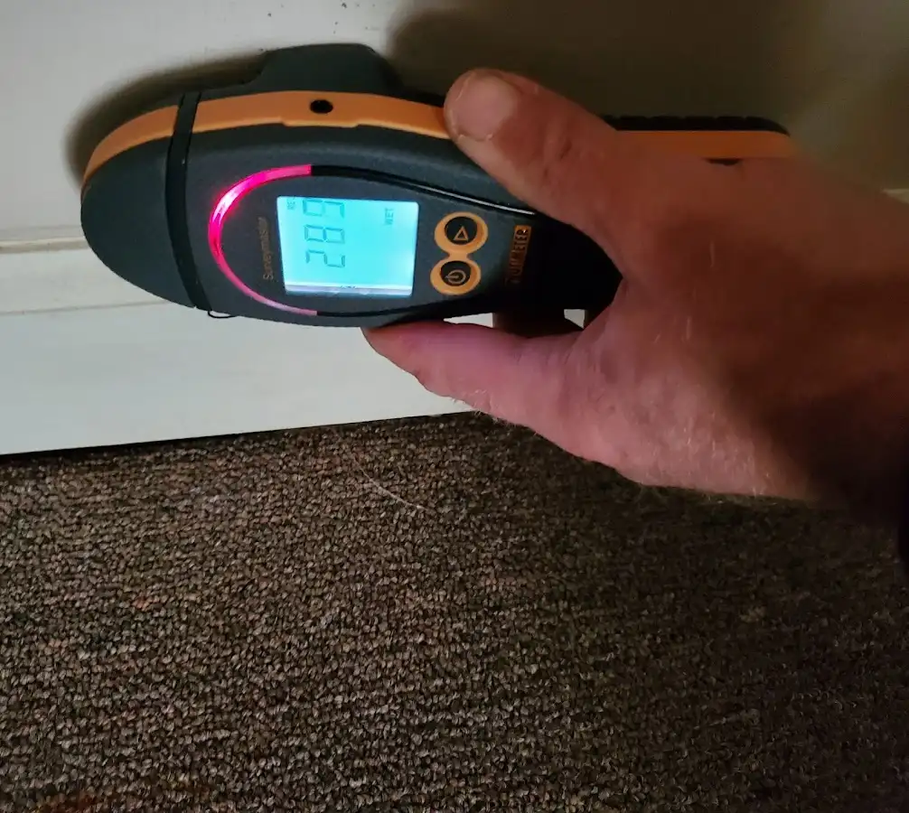 Moisture detection at baseboard during Sewage Cleanup & Sanitation in Salina